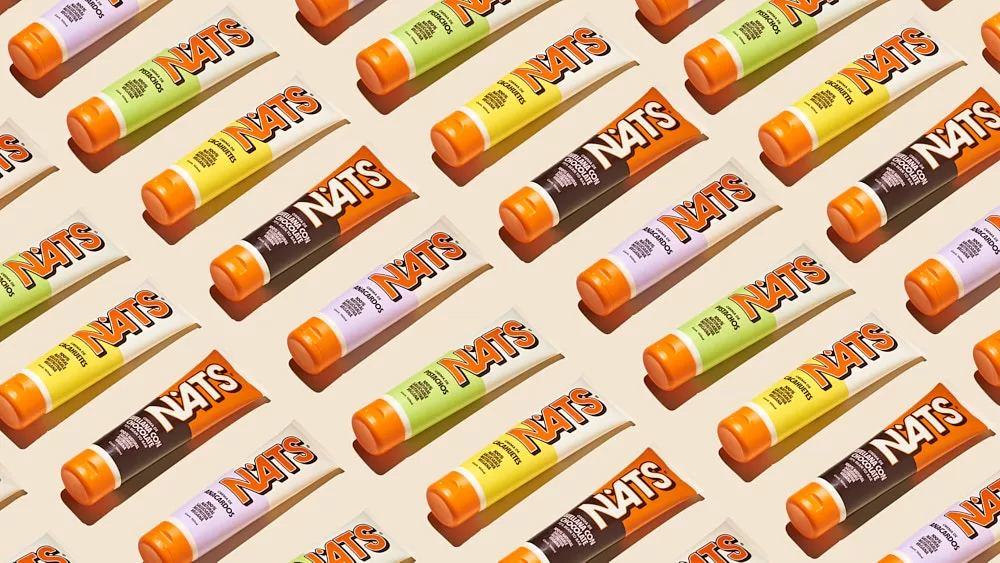 Bold graphic of organic and vegan NATs nut butter tubes