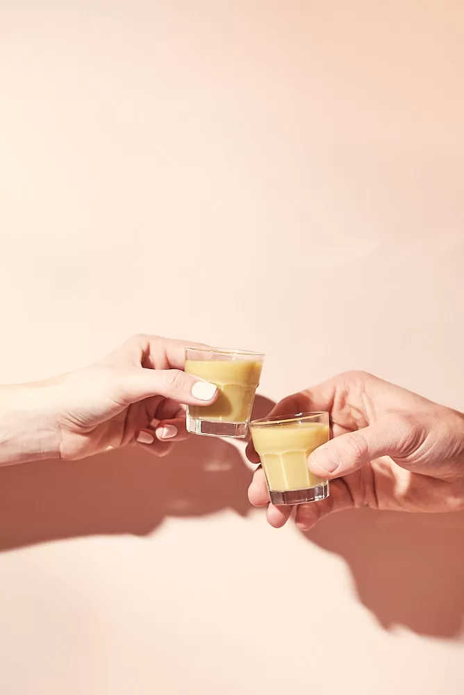Bright and colorful drinks photography of ginger shots