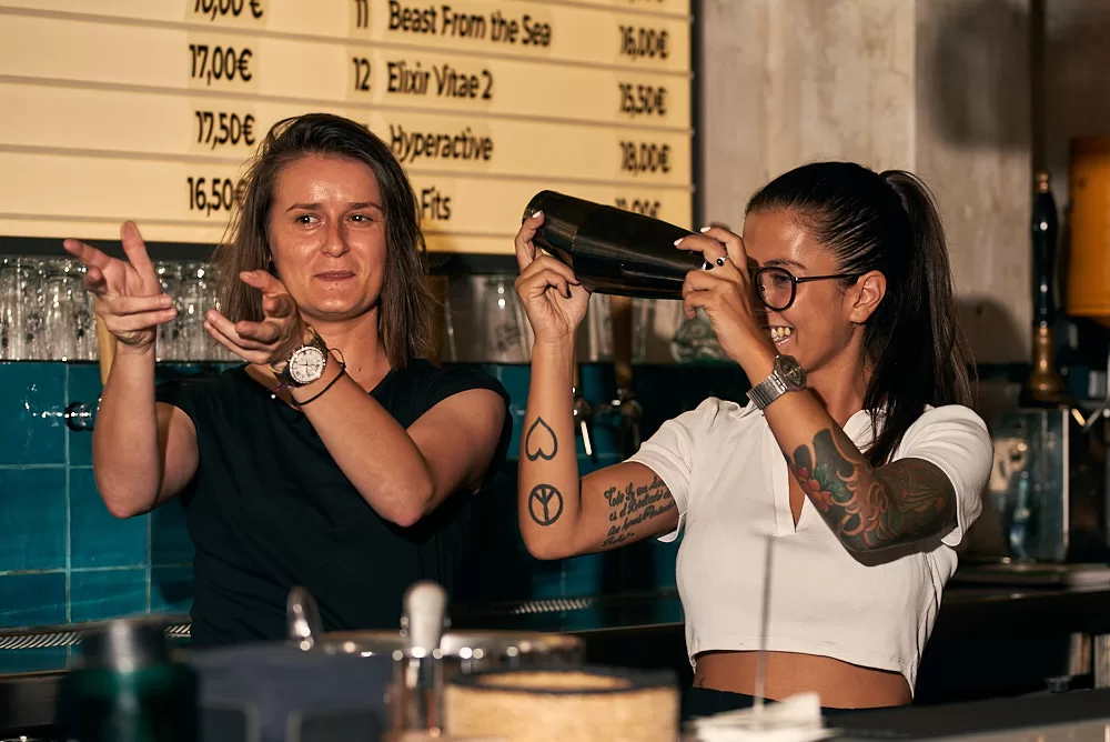 Event photography of two bartenders making cocktails at a Barcelona restaurant