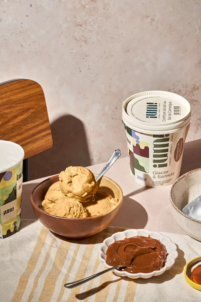 Product photography for French Ice cream brand in Barcelona. ice cream sitting on a dinner table. corrected in photoshop