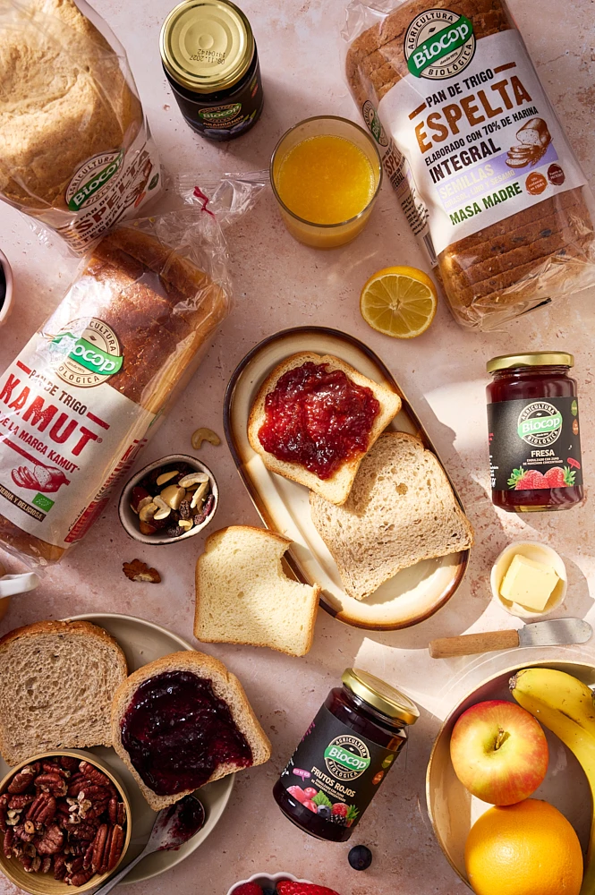 Food photography at a breakfast table of peanut butter jelly yogurt with raspberries